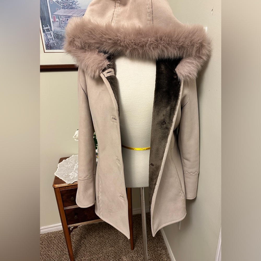 Elegant Fur-Trimmed Women's zip up coat jacket.